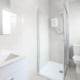 Light small minimalistic bathroom in a house with window