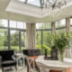 Sunroom with Glass elegant chandelier in creative conservatory in the morning with backyard on the background